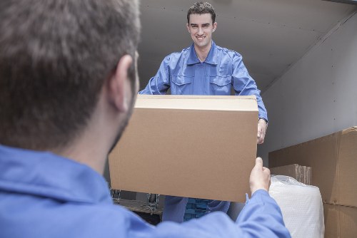 House movers planning a home removal in Sydenham with packed boxes and furniture