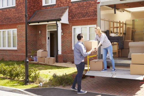 Commercial moving team handling desks and equipment