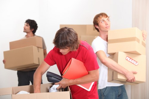 Household furniture being carried through a Sydenham property