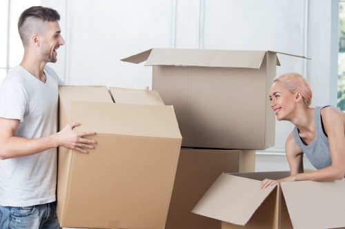 Professional movers handling household items carefully