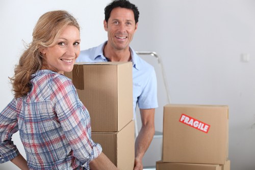 Packed moving boxes and protective wrapping prepared for transport