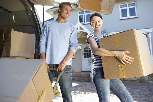 Unloading furniture and boxes at a new home in Sydenham